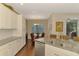 Bright kitchen features granite countertops, white cabinets, stainless steel appliances and a breakfast nook at 12229 Stuart Dr, Venice, FL 34293