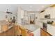 Well-designed kitchen featuring granite countertops, stainless steel appliances, and seating at the breakfast bar at 12229 Stuart Dr, Venice, FL 34293