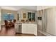 Kitchen showcasing granite countertops, stainless steel appliances, and an adjacent dining area at 12229 Stuart Dr, Venice, FL 34293