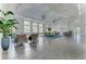 Community club house with elegant decor and several seating groups at 12229 Stuart Dr, Venice, FL 34293