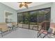 Inviting screened patio with comfortable seating offers a tranquil space to relax and enjoy the landscaped surroundings at 12229 Stuart Dr, Venice, FL 34293