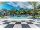 Upscale pool surrounded by palm trees at 12229 Stuart Dr, Venice, FL 34293