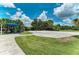 Enjoy a game of beach volleyball on a sand court with shade and lounge seating at 12229 Stuart Dr, Venice, FL 34293