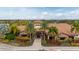 Sprawling community building featuring a tile roof, lush landscaping and well-maintained grounds at 12856 Sorrento Way, Bradenton, FL 34211