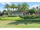 Elegant entrance to Esplanade Golf & Country Club showcasing lush landscaping and the community sign at 12856 Sorrento Way, Bradenton, FL 34211