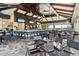 Spacious outdoor dining area with a bar, offering a perfect spot for relaxation and entertainment at 12856 Sorrento Way, Bradenton, FL 34211