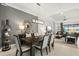 Open-concept dining room adjacent to the living area with modern lighting and stylish decor at 12856 Sorrento Way, Bradenton, FL 34211
