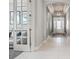 Inviting foyer with tile flooring, tray ceiling, and a view of the formal living spaces at 12856 Sorrento Way, Bradenton, FL 34211