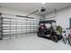 Spacious garage featuring a golf cart, bicycle, and ample storage space at 12856 Sorrento Way, Bradenton, FL 34211