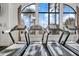Well-equipped gym featuring treadmills with scenic views through large windows, promoting a healthy lifestyle at 12856 Sorrento Way, Bradenton, FL 34211