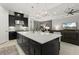 Open kitchen featuring a large island and adjacent living spaces at 12856 Sorrento Way, Bradenton, FL 34211