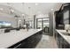 Spacious kitchen with a large island, modern appliances, and access to an outdoor patio at 12856 Sorrento Way, Bradenton, FL 34211