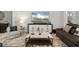 Comfortable living room featuring a decorative coffee table, stylish rug, and modern furniture at 12856 Sorrento Way, Bradenton, FL 34211