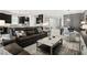 Cozy living room with modern furniture, a decorative coffee table, and an open floor plan at 12856 Sorrento Way, Bradenton, FL 34211