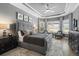 Elegant main bedroom with tray ceilings, bay windows, and a serene gray color palette at 12856 Sorrento Way, Bradenton, FL 34211