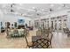 Spacious meeting room with tables, chairs, tile floors, and large windows offering plenty of natural light at 12856 Sorrento Way, Bradenton, FL 34211