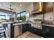 Outdoor kitchen with stainless steel grill, wet bar and screened patio offers great outdoor entertaining at 12856 Sorrento Way, Bradenton, FL 34211