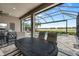 Inviting outdoor living area with an expansive view of the pool, spa, and the lake at 12856 Sorrento Way, Bradenton, FL 34211