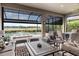 Comfortable screened-in patio offers peaceful views of lake and swimming pool at 12856 Sorrento Way, Bradenton, FL 34211