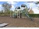Community playground featuring a slide, climbing structures, and soft ground covering at 12856 Sorrento Way, Bradenton, FL 34211