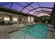 Beautiful screened-in pool with spa and lake view offers the best outdoor living at 12856 Sorrento Way, Bradenton, FL 34211