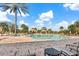 Resort-style community pool with lounge chairs and well-maintained brickwork surrounding it on a sunny day at 12856 Sorrento Way, Bradenton, FL 34211
