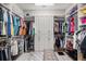 Spacious walk-in closet with ample storage, custom shelving, and a central island for organization at 12856 Sorrento Way, Bradenton, FL 34211