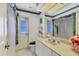Bathroom with a vanity, large mirror, and shower with curtain at 1304 Alton Rd, Port Charlotte, FL 33952