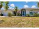 Attractive one-story residence boasting a well-kept lawn and vibrant greenery at 1304 Alton Rd, Port Charlotte, FL 33952