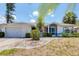 Inviting one-story home featuring manicured landscaping and a spacious two-car garage at 1304 Alton Rd, Port Charlotte, FL 33952