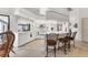 Bright kitchen featuring all white appliances, counter seating, and ample countertop space at 1304 Alton Rd, Port Charlotte, FL 33952