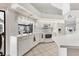 Bright kitchen featuring white appliances, countertops, and cabinetry with tile flooring, and lots of natural light at 1304 Alton Rd, Port Charlotte, FL 33952