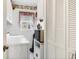 Well-lit laundry room with washer, dryer, and ample storage space at 1304 Alton Rd, Port Charlotte, FL 33952