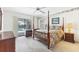 Inviting main bedroom with four-poster bed and access to the pool area through sliding glass doors at 1304 Alton Rd, Port Charlotte, FL 33952