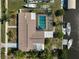Aerial view of backyard with pool, boat dock, and canal access, showcasing waterfront living at 149 Small Se St, Port Charlotte, FL 33952