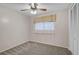 Cozy bedroom features neutral paint, carpet, closet and overhead lighting at 149 Small Se St, Port Charlotte, FL 33952