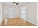Open dining area featuring hardwood floors, neutral walls, and views into the kitchen at 149 Small Se St, Port Charlotte, FL 33952