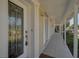 Inviting covered porch with decorative front door, creating an elegant entryway to the home at 149 Small Se St, Port Charlotte, FL 33952