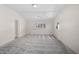Light-filled living room with neutral paint, carpet floors, and abundant natural light at 149 Small Se St, Port Charlotte, FL 33952
