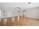 Open living space with gleaming hardwood floors, recessed lighting, and views into other rooms at 149 Small Se St, Port Charlotte, FL 33952