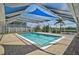 Inviting pool area enclosed by a covered and screened lanai, perfect for outdoor relaxation at 149 Small Se St, Port Charlotte, FL 33952