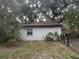 Backyard shot of a single story home with a chain link fence at 1511 11Th W Ave, Palmetto, FL 34221