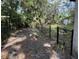 Backyard shot of a single story home with a chain link fence at 1511 11Th W Ave, Palmetto, FL 34221