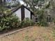 Exterior shot of a single story home with tropical landscaping at 1511 11Th W Ave, Palmetto, FL 34221