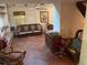 Living room featuring tile floors and vintage furniture at 1511 11Th W Ave, Palmetto, FL 34221