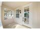 Welcoming entryway with a decorative front door and sidelight window at 1519 Napoli E Dr, Sarasota, FL 34232
