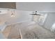 Aerial view of living room with ceiling fan, carpet, and access to kitchen at 1519 Napoli E Dr, Sarasota, FL 34232