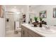 Bathroom featuring double sinks, a walk-in shower, and contemporary finishes for a luxurious feel at 16646 San Nicola Pl, Bradenton, FL 34211