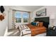 Bright bedroom featuring stylish décor, a comfortable bed, and plenty of natural light from the windows at 16646 San Nicola Pl, Bradenton, FL 34211