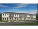 Modern townhouse complex featuring neutral toned exteriors, well-maintained landscaping, and inviting curb appeal at 16646 San Nicola Pl, Bradenton, FL 34211